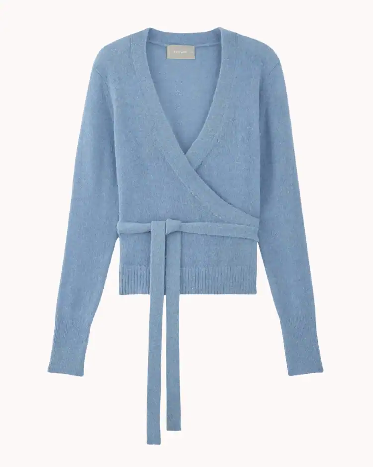 Blue+wrap+cardigan+on+a+plain+beige+background
