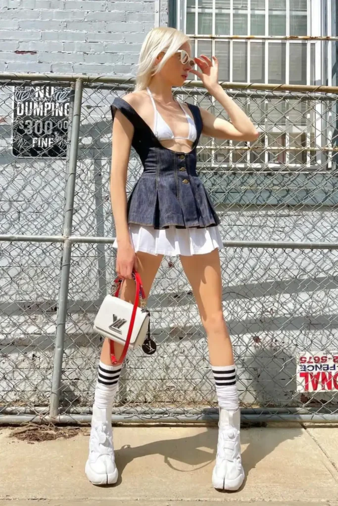 trendy woman wearing white tabi high top trainers
