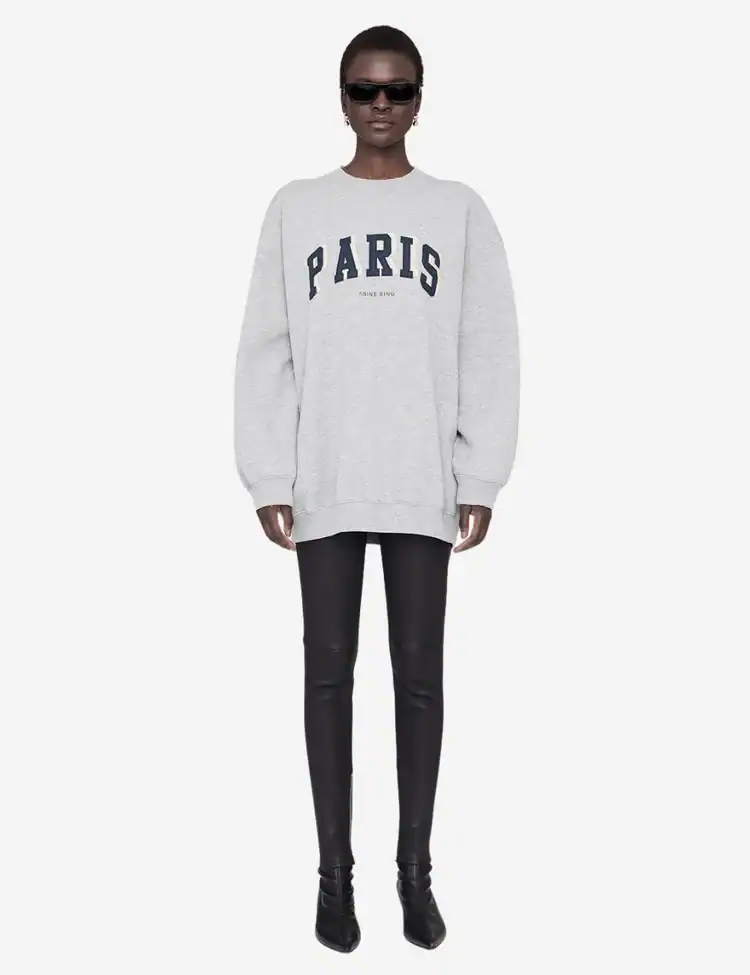model wearing a grey jumper