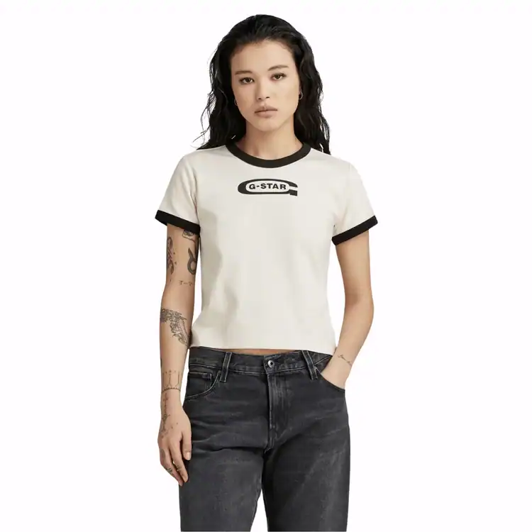 Model wears white logo top black jeans. Best Y2K fashion brands. Best Y2K fashion brands