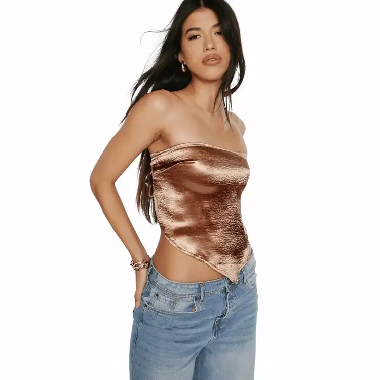 model wears metallic bandeau top. Best Y2K Fashion brands