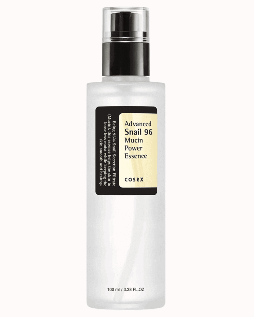 COSRX Advanced snail 96 mucin power essence on a plain pastel pink background
