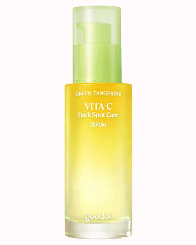 Goodal Green Tangerin Vita C Dark Spot Serum on a plain pastel pink background