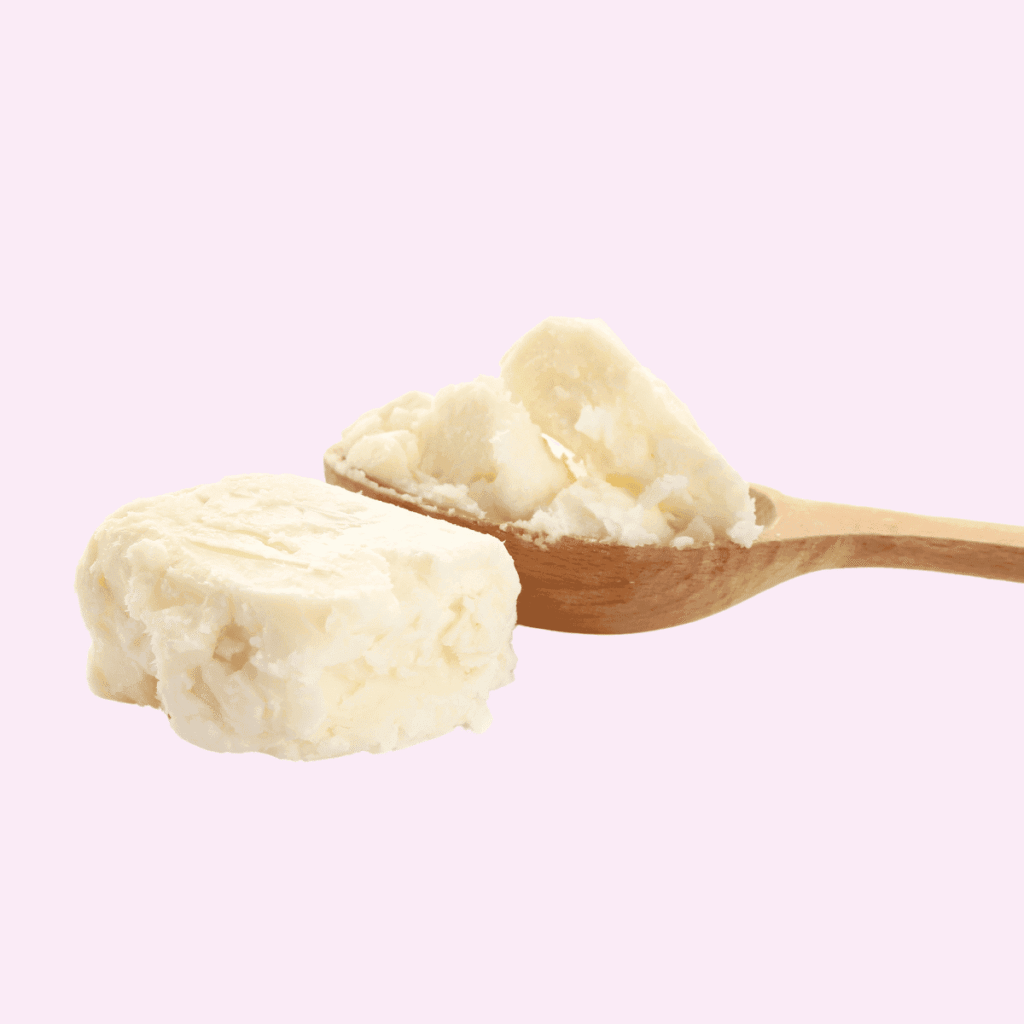 Scoop of shea butter in a wooden spoon on a plain pink background. Low porosity hair oils to avoid 
