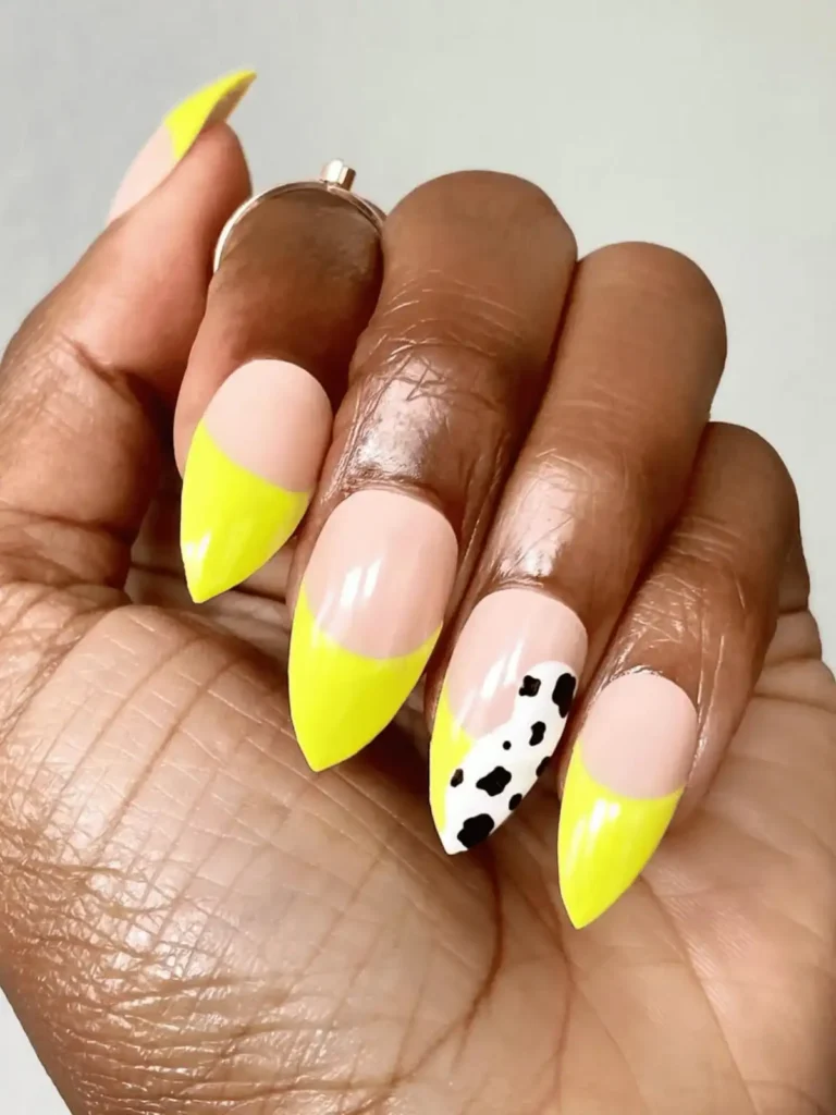 Yellow neon cow print nails