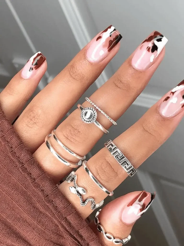 dark brown cow print nails