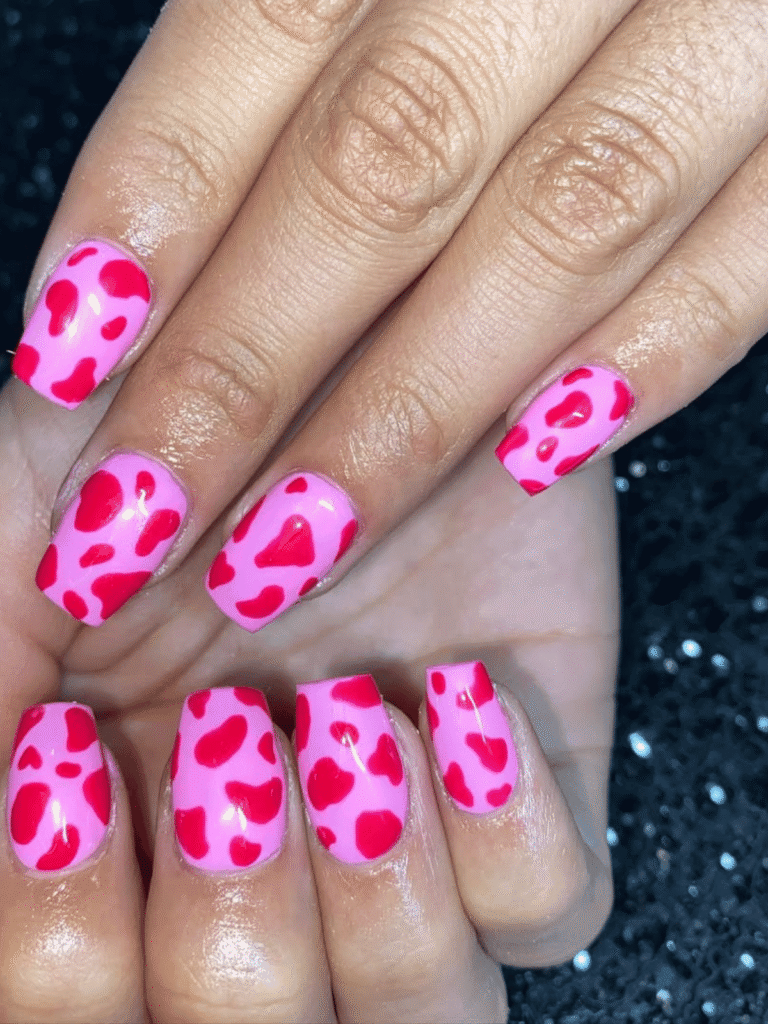 pink and red cow print nails