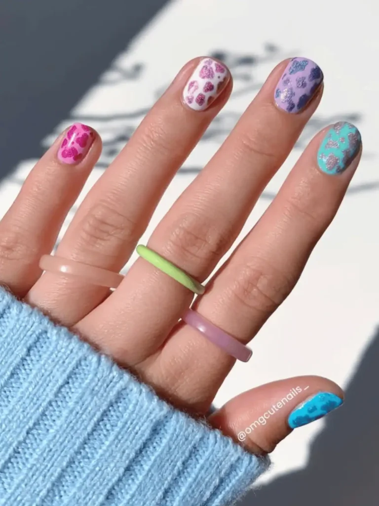 red purple and blue cow print nails