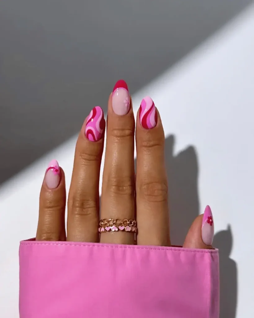 Pink swirly nail design.