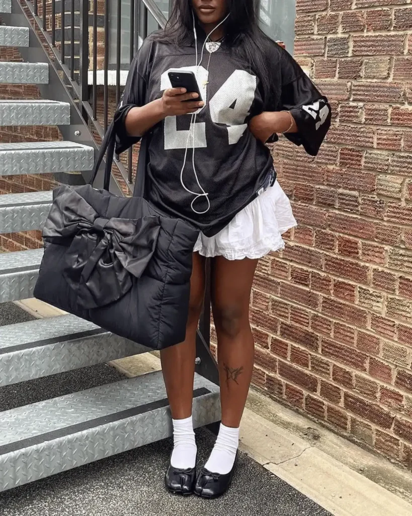 frilly skirt outfit with a large bow bag