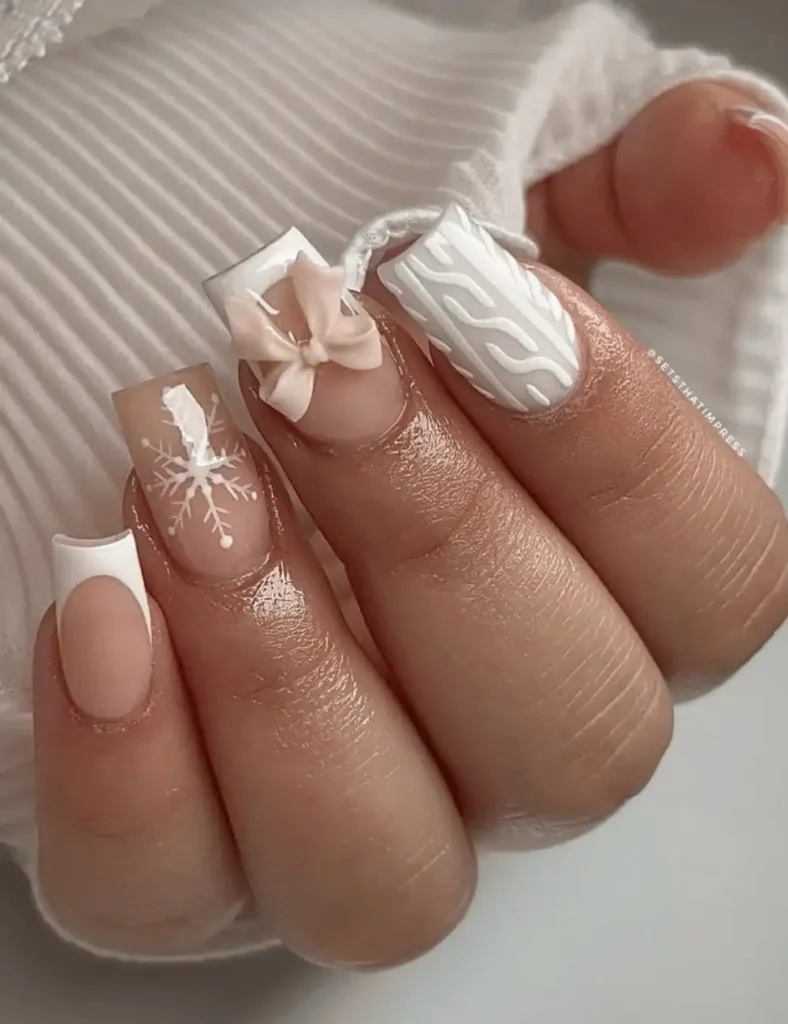 white sweater and bow christmas nails