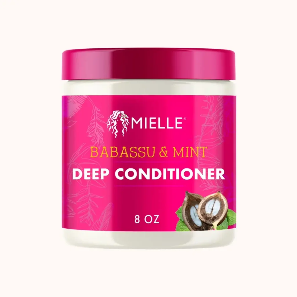Jar of Mielle Babassu Oil and Mint Deep Conditioner on a plain background
